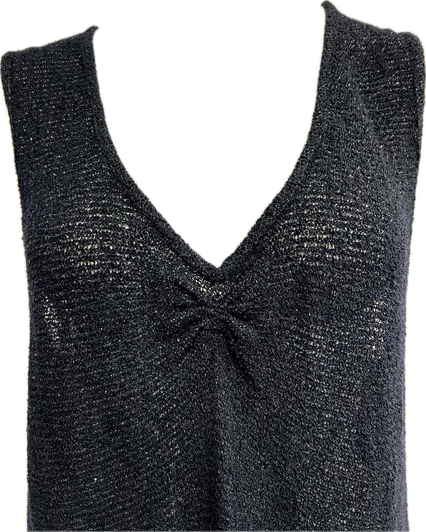 Sleeveless black knit top with gathered detail
